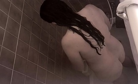 Hidden Cam Films A Busty Amateur Brunette Taking A Shower