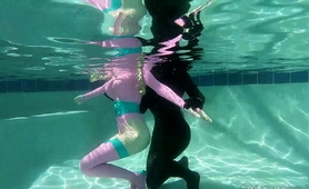 Amateur Lesbian Freaks In Latex Having Fun In The Pool