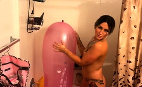 Tattooed Babe Teasing With A Big Balloon In The Shower