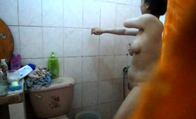 voyeur-spying-on-a-busty-mature-asian-wife-in-the-bathroom